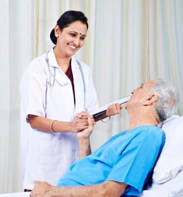 Female doctor talking with a senior patient and smiling