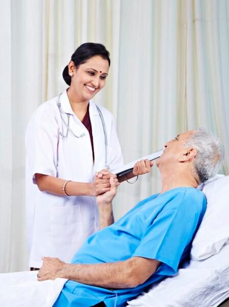 Female doctor talking with a senior patient and smiling